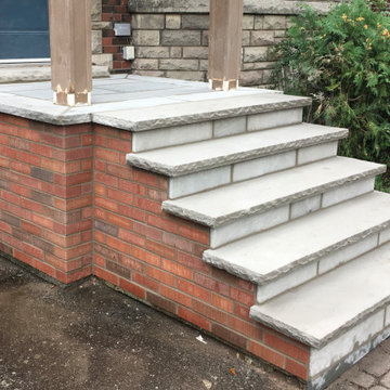 Masonry Stone Porch & Steps with Thin Veneer brick side Application.