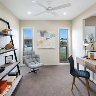 Inspiration for a mid-sized transitional study room in Brisbane with beige walls, carpet and a freestanding desk.