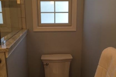 Example of a mid-sized minimalist master bathroom design in Philadelphia with granite countertops