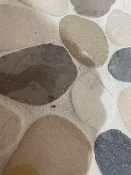 New shower floorAre the small holes in the grout ok? Future problems?