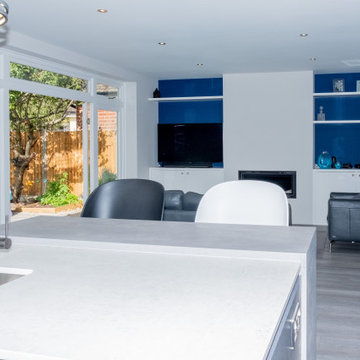 Handless Kitchen with Blue Splashback in Stanmore By Kudos Interior Designs