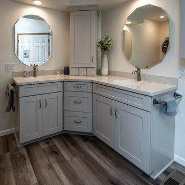 Waypoint Gray Shaker Door Cabinetry with Tiled Shower and Matching Tub Surround
