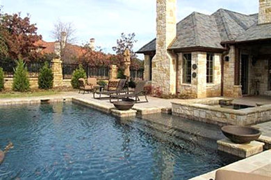 Inspiration for a large timeless one-story stone exterior home remodel in Dallas