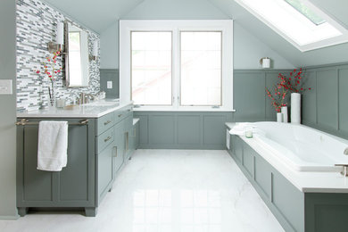 Transitional bathroom photo in Minneapolis with an undermount sink, flat-panel cabinets, quartz countertops and a two-piece toilet