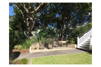 Mediterranean front yard partial sun formal garden in Brisbane with concrete pavers for spring.