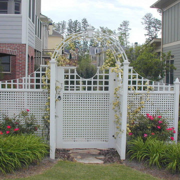 Climbing roses on arbor, shrub roses at trellis, garden entry and privacy