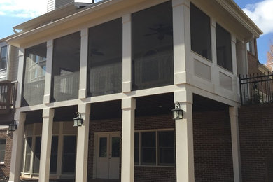 Elegant stamped concrete screened-in porch photo in Atlanta