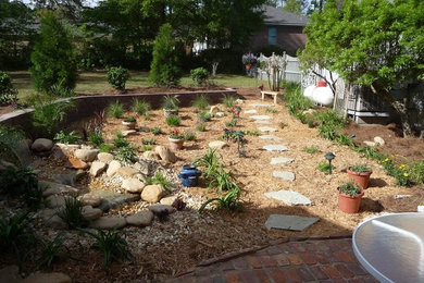 This is an example of a mid-sized traditional backyard mulch garden path in Atlanta.