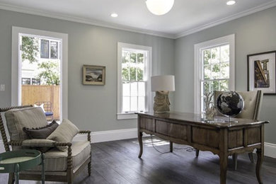 Home office - medium tone wood floor and gray floor home office idea in Portland