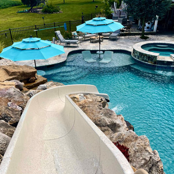 Plaster Pool Project with Waterslide and Spa.