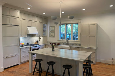 Eat-in kitchen - mid-sized transitional l-shaped eat-in kitchen idea in Charleston with shaker cabinets, quartzite countertops and an island