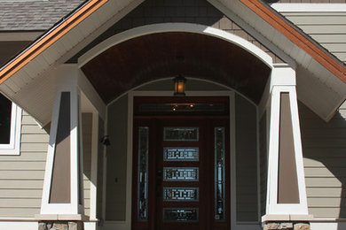 Mid-sized craftsman beige one-story concrete fiberboard exterior home idea in Other with a shingle roof