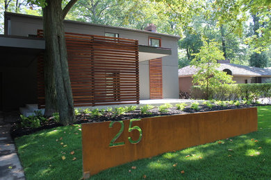 Inspiration for a contemporary gray two-story exterior home remodel in Toronto