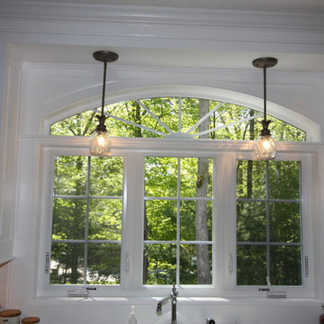 Custom White Kitchen with Scottish Meadow Granite tops
