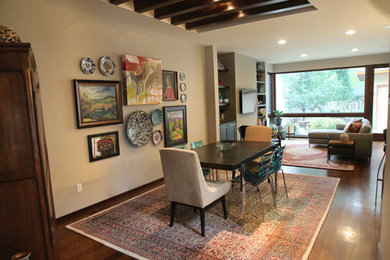 Inspiration for a mid-sized eclectic dark wood floor and brown floor kitchen/dining room combo remodel in Detroit with beige walls