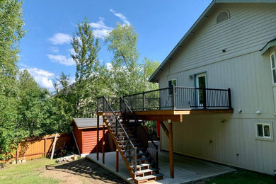 Inspiration for a mid-sized craftsman backyard second story metal railing deck remodel in Other with no cover