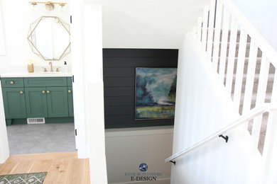 Example of a small transitional porcelain tile and gray floor powder room design in Vancouver with shaker cabinets, green cabinets, white walls, an undermount sink, quartz countertops, white countertops and a built-in vanity