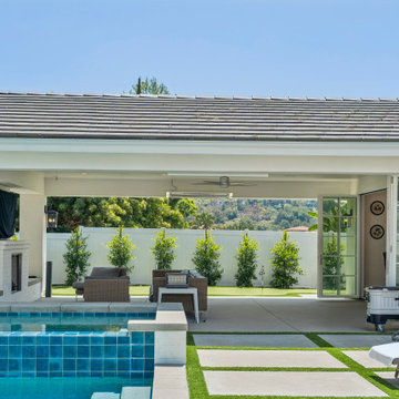 Outdoor Lounge Area with Fireplace and Pool