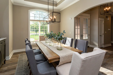 Example of a transitional dining room design in Other