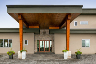 Trendy entryway photo in Vancouver with a medium wood front door