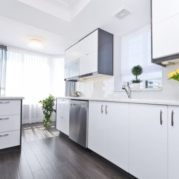 Condo kitchen counter top. Traditional design. Quartz cool colors.