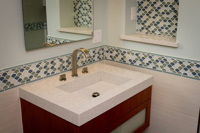 Bathroom - contemporary bathroom idea in Los Angeles with an integrated sink and quartz countertops
