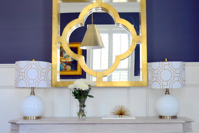 Inspiration for a mid-sized contemporary medium tone wood floor enclosed dining room remodel in Charleston with blue walls and no fireplace