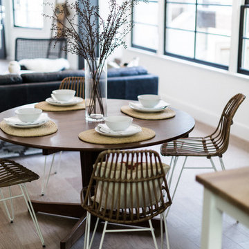 Rattan Paperclip Leg Dining Chairs with Vintage Dining Table in Open Plan Kitche