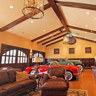 シャーロットの巨大なトラディショナルスタイルのおしゃれな着席型バー (アンダーカウンターシンク、家具調キャビネット、濃色木目調キャビネット、大理石カウンター、コンクリートの床、オレンジの床) の写真