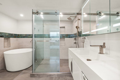Example of a large minimalist master gray tile and cement tile cement tile floor, gray floor and single-sink bathroom design in Los Angeles with flat-panel cabinets, white cabinets, a two-piece toilet, gray walls, a console sink, quartz countertops, white countertops, a niche and a floating vanity