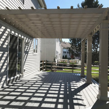 Backyard Deck With Corner-Wrapped Steps and Pergola