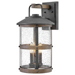 HInkley - Hinkley Lakehouse Medium Wall Mount Lantern, Aged Zinc - The look is relaxed, but the components of Lakehouse are quietly satisfying. Lakehouse features a distressed, Aged Zinc with Driftwood Gray and Black finish accompanied by clear seedy glass. Cast aluminum construction ensures Lakehouse will withstand for years. Blissfully simple, yet all the details are memorable.