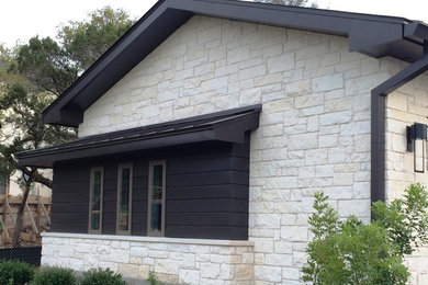 Design ideas for a contemporary white exterior in Austin with metal siding.