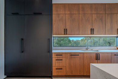 Inspiration for a contemporary kitchen remodel in Phoenix with flat-panel cabinets and medium tone wood cabinets