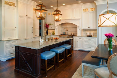 Mid-sized transitional l-shaped dark wood floor and brown floor eat-in kitchen photo in Detroit with shaker cabinets, white cabinets, granite countertops, multicolored backsplash, stone slab backsplash, an island, a farmhouse sink, white appliances and beige countertops