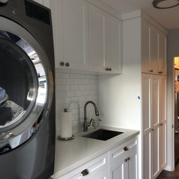 Small yet Uncluttered Laundry Room in White