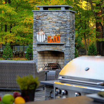 Make a Statement with a Versatile Outdoor Kitchen and Double Fire Feature