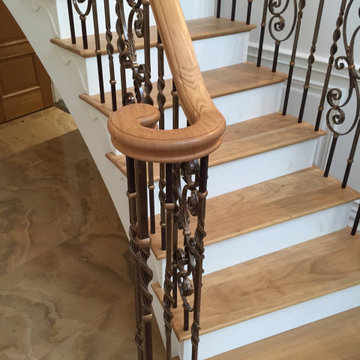 Helical staircase with very fine French wrought iron balustrading in antique bro
