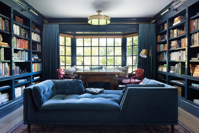 Large elegant light wood floor and beige floor home office library photo in San Francisco with white walls