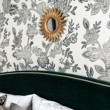 Moody Primary Bedroom with Floral Grasscloth Wallpaper Green Velvet Bed Deep War