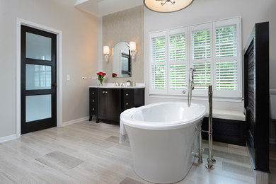 Inspiration for a transitional bathroom remodel in Other with dark wood cabinets