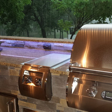 L Shaped Outdoor Kitchen With Unique Lighting