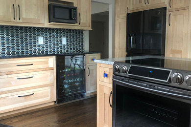 Example of a mid-sized trendy eat-in kitchen design in Grand Rapids
