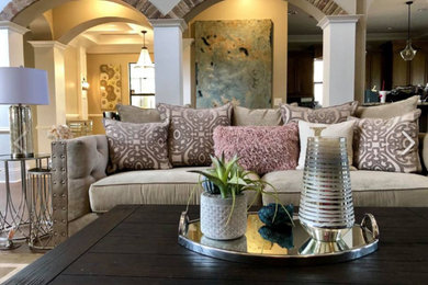 Example of a mid-sized transitional formal and open concept medium tone wood floor and brown floor living room design in Birmingham with white walls, no fireplace and no tv