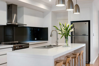 Photo of a contemporary kitchen in Perth with black splashback.