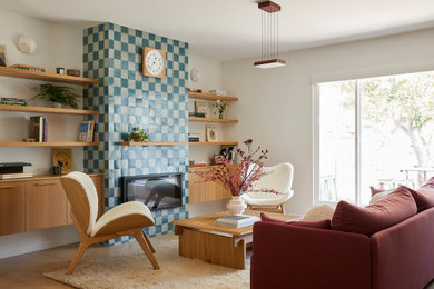 Inspiration for a mid-sized contemporary open concept light wood floor and brown floor living room remodel in San Francisco with a music area, white walls, a standard fireplace, a tile fireplace and no tv