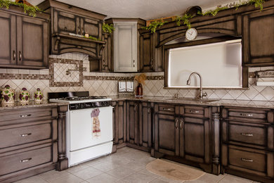 Inspiration for a mid-sized l-shaped eat-in kitchen remodel in Other with an undermount sink, raised-panel cabinets, quartz countertops, ceramic backsplash, an island and gray countertops