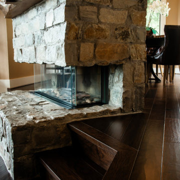 Cozy RetreatThis custom stone fireplace features a stunning glass design, allowi