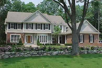 Huge traditional two-story mixed siding gable roof idea in Detroit