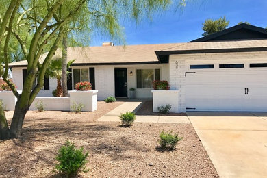 Example of a cottage exterior home design in Phoenix